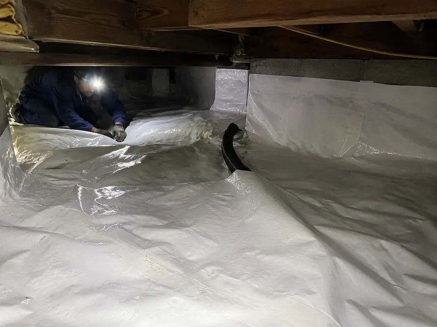 Sealed crawl space vapor barrier for radon mitigation in Pueblo county home